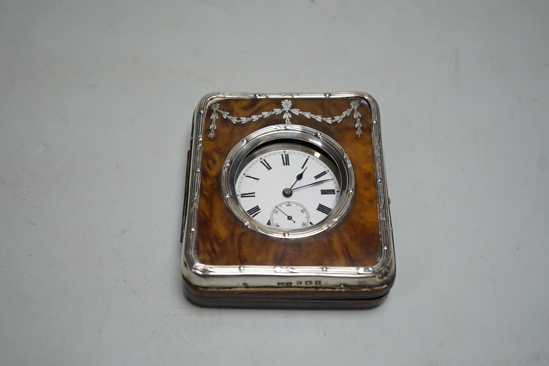 A tortoiseshell hallmarked silver pocket watch holder